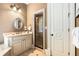 Elegant bathroom features a classic vanity, framed mirror and glass shower enclosure at 450 Dorset Sw Way, Smyrna, GA 30082