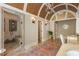 Elegant bathroom featuring a spacious shower, double sink vanity, and arched ceiling with chandelier at 450 Dorset Sw Way, Smyrna, GA 30082