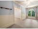 Bright bedroom with wainscoting, light blue walls, a chandelier and a large window at 450 Dorset Sw Way, Smyrna, GA 30082