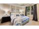 Comfortable bedroom with natural light, complemented by tray ceilings and contemporary decor at 450 Dorset Sw Way, Smyrna, GA 30082