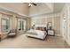 Spacious bedroom features tray ceilings, soft carpet, and large windows at 450 Dorset Sw Way, Smyrna, GA 30082