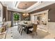 Elegant dining space with modern chandelier, neutral color scheme, and natural light at 450 Dorset Sw Way, Smyrna, GA 30082