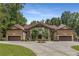 Stately brick home featuring symmetrical design, dual garages, and manicured landscaping at 450 Dorset Sw Way, Smyrna, GA 30082