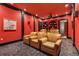 Home theater with tiered seating, wall mounted speakers, and ambient lighting for a cinema experience at 450 Dorset Sw Way, Smyrna, GA 30082