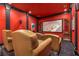 Private home theatre with comfortable seating and a large screen for an immersive viewing experience at 450 Dorset Sw Way, Smyrna, GA 30082