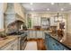 Well-equipped kitchen featuring stainless steel appliances, granite countertops, and a large kitchen island at 450 Dorset Sw Way, Smyrna, GA 30082