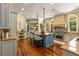 Gourmet kitchen with custom cabinets, center island with seating, and professional grade stainless appliances at 450 Dorset Sw Way, Smyrna, GA 30082