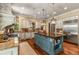 Large kitchen with custom island, professional range, stainless steel appliances, and custom cabinetry at 450 Dorset Sw Way, Smyrna, GA 30082