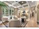 Bright living room with coffered ceilings offering views into multiple rooms, including kitchen and formal dining areas at 450 Dorset Sw Way, Smyrna, GA 30082