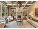 Cozy living room with coffered ceilings, a fireplace, and built-in shelving for storage and display at 450 Dorset Sw Way, Smyrna, GA 30082