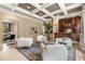 Open living room area featuring coffered ceilings, comfortable seating and a wet bar for entertaining friends and Gathering at 450 Dorset Sw Way, Smyrna, GA 30082
