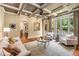 Inviting living room with backyard view, coffered ceilings, neutral decor, and hardwood floors at 450 Dorset Sw Way, Smyrna, GA 30082