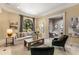 Cozy living area with neutral decor, large window, and access to other rooms at 450 Dorset Sw Way, Smyrna, GA 30082