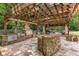 Stone outdoor kitchen under pergola, ideal for entertaining at 450 Dorset Sw Way, Smyrna, GA 30082