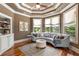 Sitting room offers great natural light, hardwood floors, and built-in shelving at 450 Dorset Sw Way, Smyrna, GA 30082