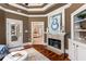 Sitting room features hardwood floors and fireplace with a tranquil view at 450 Dorset Sw Way, Smyrna, GA 30082