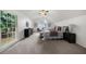 Spacious bedroom featuring large window, carpet, ceiling fan, and neutral decor at 11660 Windbrooke Way, Johns Creek, GA 30005