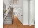 Spacious foyer with hardwood floors, a staircase, and a light and airy feel at 11660 Windbrooke Way, Johns Creek, GA 30005