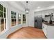 Bright kitchen with large windows, stainless refrigerator, and wood floors for a contemporary feel at 11660 Windbrooke Way, Johns Creek, GA 30005