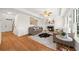 Inviting living room with fireplace and access to staircase at 11660 Windbrooke Way, Johns Creek, GA 30005