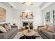Cozy living room with fireplace, stylish decor and natural light at 11660 Windbrooke Way, Johns Creek, GA 30005