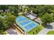 Aerial view of the community tennis courts showing the pool, clubhouse, and mature trees around the property at 11660 Windbrooke Way, Johns Creek, GA 30005