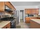 Updated kitchen featuring stainless steel appliances and a modern design at 2468 Whistle Stop Dr, Norcross, GA 30071