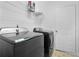 Laundry room featuring a side-by-side washer and dryer with a storage shelf above at 2468 Whistle Stop Dr, Norcross, GA 30071