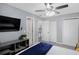 Cozy bedroom with entertainment center and attached doorways to other areas of the home at 3568 Foxworth Ct, Buford, GA 30519