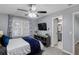 Comfortable bedroom with updated features and décor, as well as an ensuite bath at 3568 Foxworth Ct, Buford, GA 30519