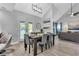 Open concept living: dining area with view of a modern living room at 3568 Foxworth Ct, Buford, GA 30519