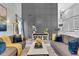 Sophisticated living room featuring a decorative accent wall, plush seating, and elegant decor at 3568 Foxworth Ct, Buford, GA 30519