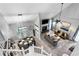 Aerial view of the living room, dining room, and kitchen featuring modern decorations and furniture at 3568 Foxworth Ct, Buford, GA 30519