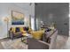 Modern living room with a gray decorative accent wall, plush seating, and eye-catching decor at 3568 Foxworth Ct, Buford, GA 30519