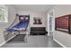 Fun recreation room featuring games and a futon, offering the perfect place to entertain guests and hang out at 3568 Foxworth Ct, Buford, GA 30519