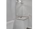 Neutral bathroom features a single vanity, cabinet and decorative tiled floors at 5696 Kilrush Se Ct, Mableton, GA 30126