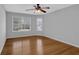 Large bedroom boasts hardwood floors, natural light and ceiling fan at 5696 Kilrush Se Ct, Mableton, GA 30126