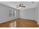Bedroom features hardwood floors, natural light and ceiling fan at 5696 Kilrush Se Ct, Mableton, GA 30126
