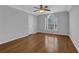 Inviting bedroom features hardwood floors, natural light and ceiling fan at 5696 Kilrush Se Ct, Mableton, GA 30126
