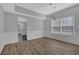 Elegant dining room featuring hardwood floors, modern chandelier, and natural light at 5696 Kilrush Se Ct, Mableton, GA 30126