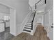Inviting entryway with staircase, modern design, and access to kitchen and other rooms at 5696 Kilrush Se Ct, Mableton, GA 30126