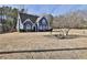 Charming two-story blue home with a well-maintained lawn and attractive landscaping at 5696 Kilrush Se Ct, Mableton, GA 30126