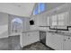 Stylish white kitchen featuring modern appliances, ample counter space, and natural light at 5696 Kilrush Se Ct, Mableton, GA 30126