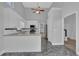 Bright, modern kitchen with white cabinets, gray countertops, and stainless steel appliances at 5696 Kilrush Se Ct, Mableton, GA 30126