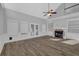 Spacious living room with fireplace, built-in shelves, and ample natural light at 5696 Kilrush Se Ct, Mableton, GA 30126