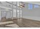 Expansive living area featuring hardwood floors, soaring ceilings, and elegant columns at 5696 Kilrush Se Ct, Mableton, GA 30126