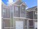 Charming two-story townhouse with a brick facade and attached garage at 229 Ivey Ter, Temple, GA 30179