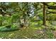 View of the backyard featuring a garden with an arbor and manicured lawn at 2355 Ewing Ne Dr, Brookhaven, GA 30319