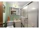 Compact bathroom featuring a shower, toilet and small vanity sink at 2355 Ewing Ne Dr, Brookhaven, GA 30319