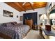 Comfortable bedroom with exposed wood beam ceiling and traditional furnishings at 2355 Ewing Ne Dr, Brookhaven, GA 30319